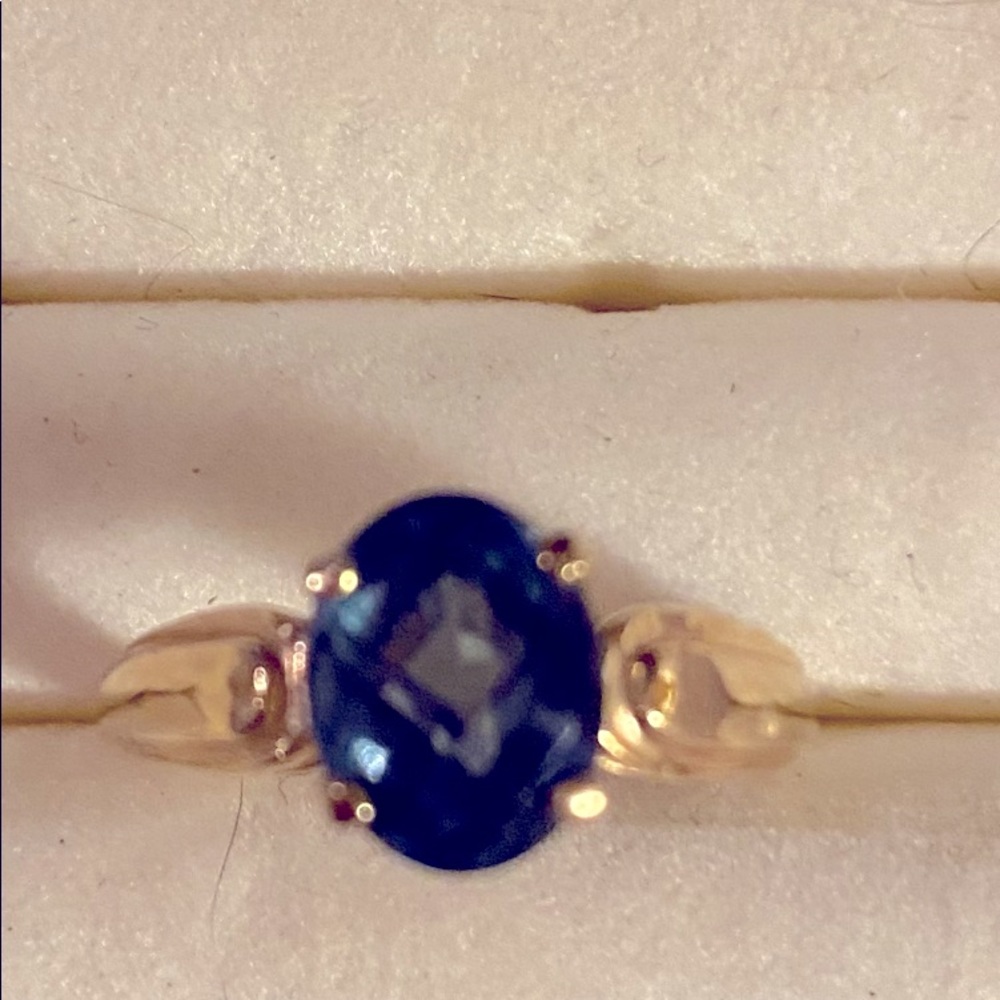 Solitaire blue topaz ring.  14k solid gold.